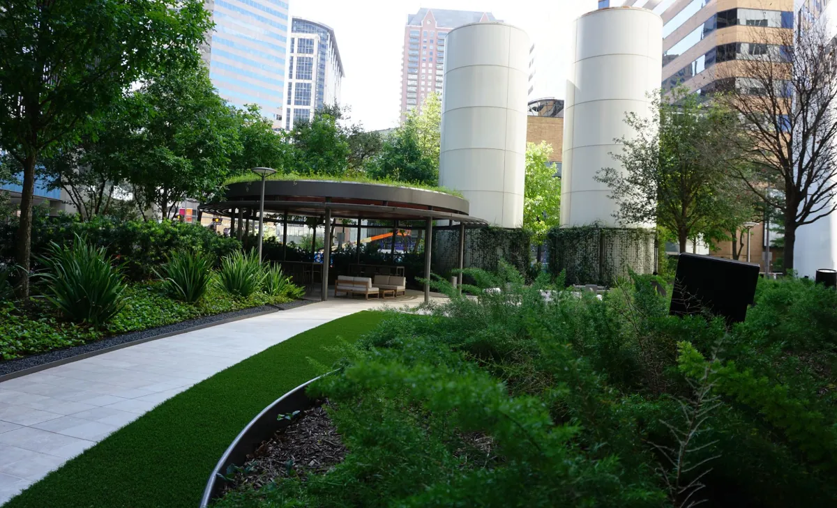 Circular steel pavilion at 1001 Fannin fabricated and installed by Renfrow+Co, framed against Houston's high-rise buildings