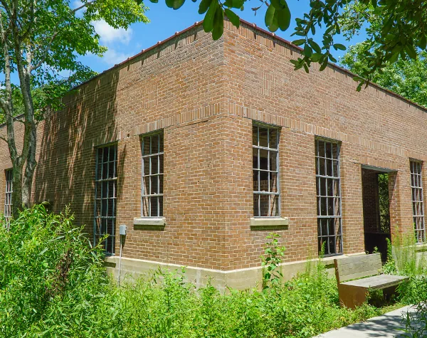 Exterior view of a brick building with large windows, part of the High Island Sky Walk project Exterior view of a brick building with large windows, part of the High Island Sky Walk project