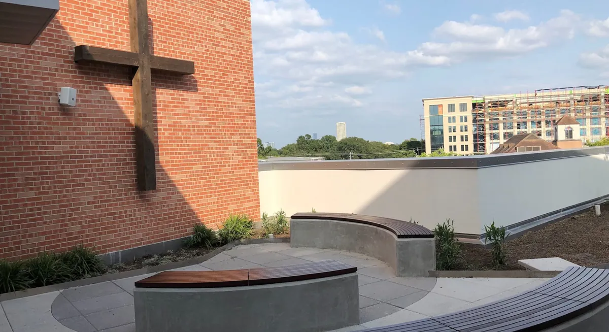 Large wooden Accoya cross mounted on a brick wall at River Oaks Baptist School, fabricated by Renfrow+Co Large wooden Accoya cross mounted on a brick wall at River Oaks Baptist School, fabricated by Renfrow+Co