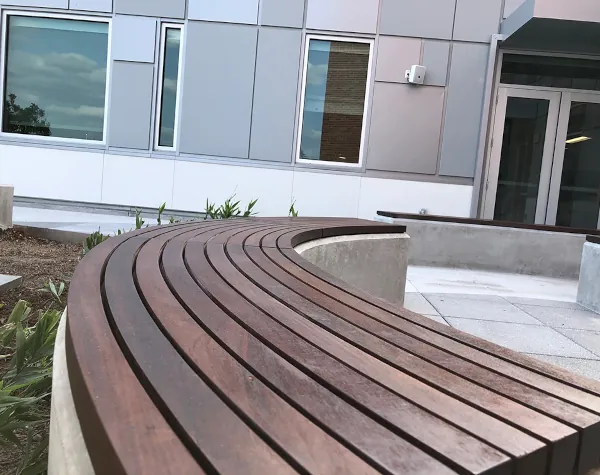 Close-up of curved wooden benches in the courtyard of River Oaks Baptist School Close-up of curved wooden benches in the courtyard of River Oaks Baptist School