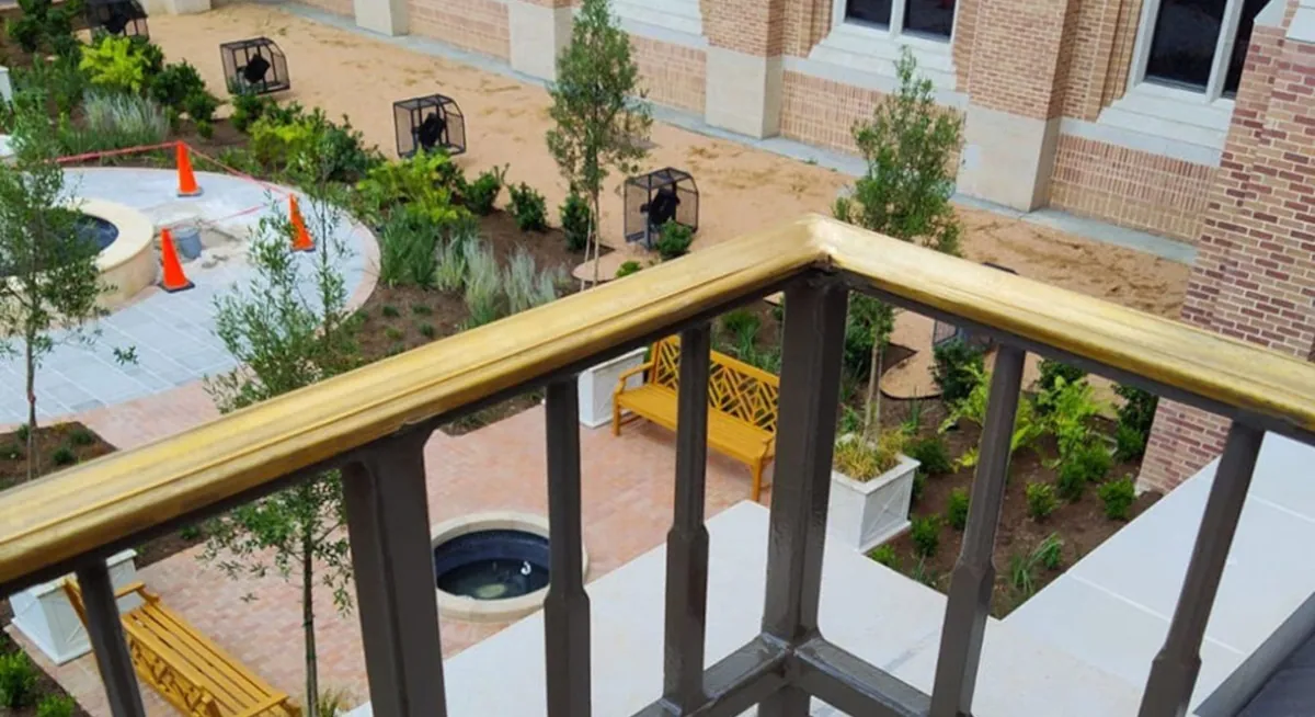 Balcony view with Renfrow+Co’s handcrafted bronze railing at St. Martin’s Church courtyard Balcony view with Renfrow+Co’s handcrafted bronze railing at St. Martin’s Church courtyard