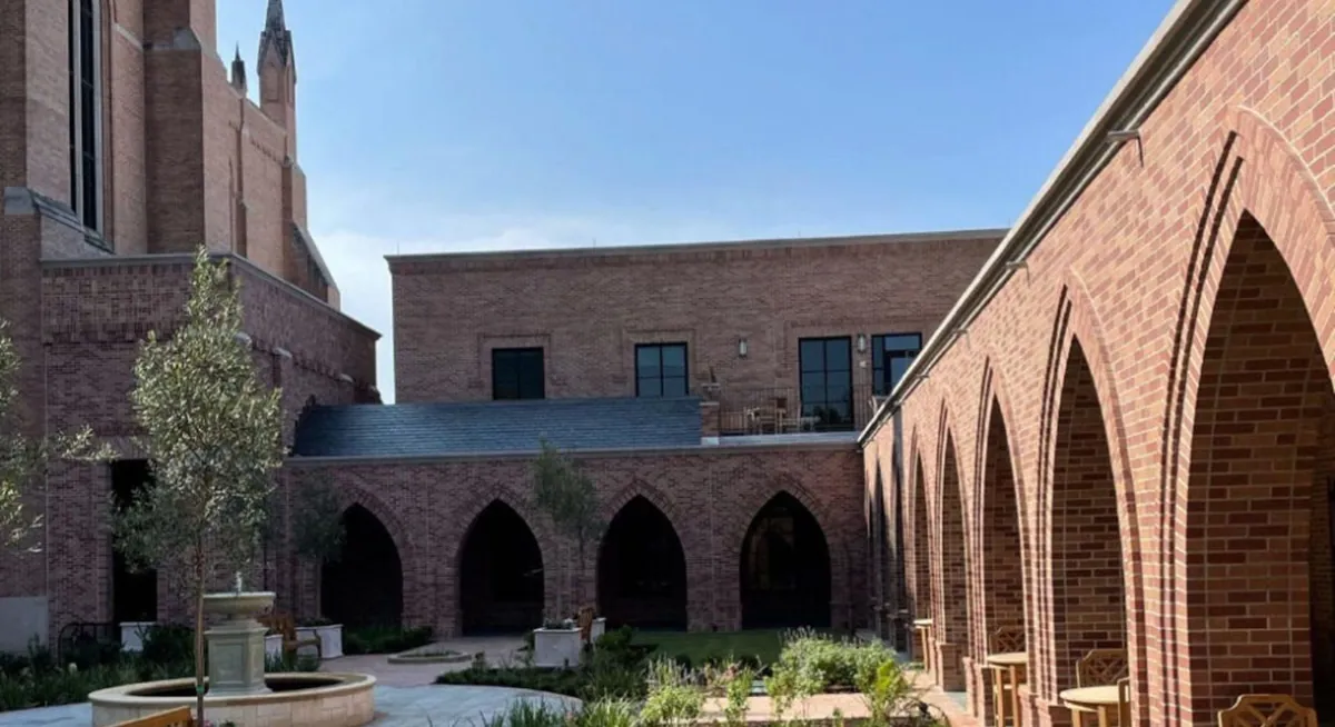 St. Martin's Church courtyard with detailed brick archways, greenery, and Renfrow+Co installed copper fountain St. Martin's Church courtyard with detailed brick archways, greenery, and Renfrow+Co installed copper fountain